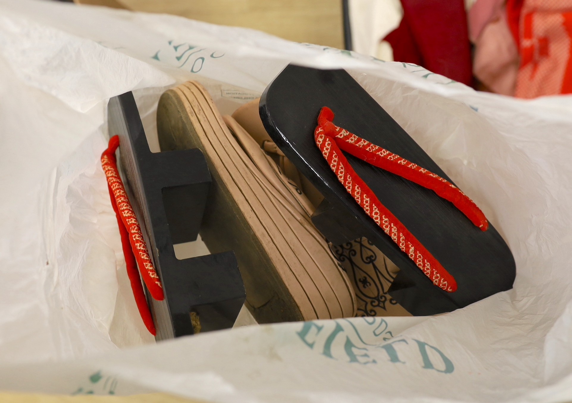 A quantity of Japanese clothing, kimonos, shoes etc